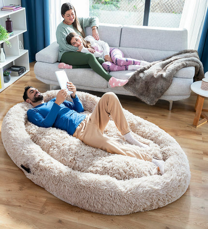 Beige human dog bed by InnovaGoods, XXL size, showing soft fabric and cozy design suitable for both pets and people.