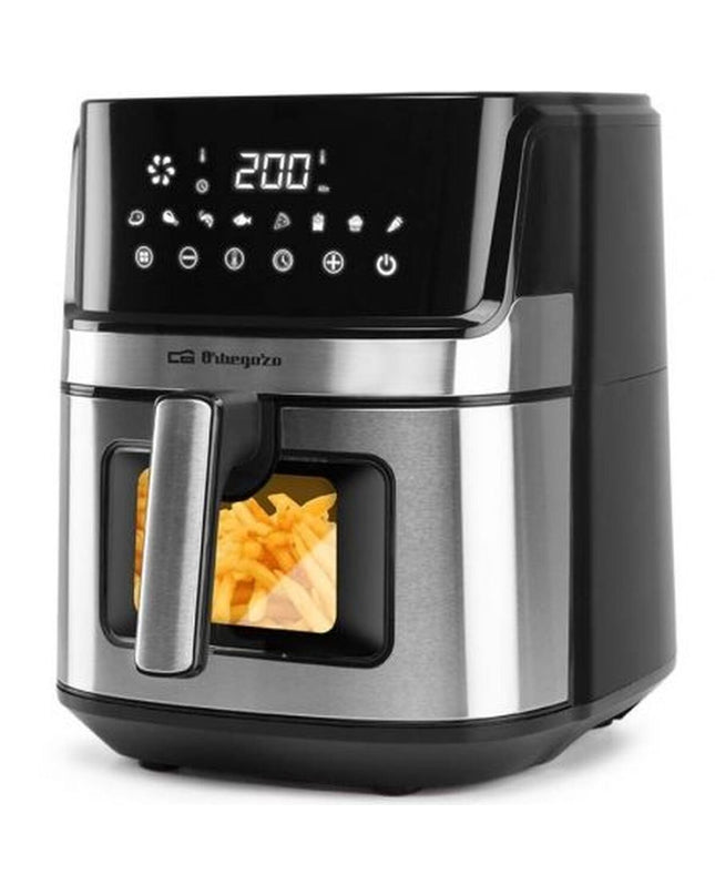 Orbegozo 18324OR air fryer, compact electric kitchen appliance with digital display and black finish, used for healthy frying.