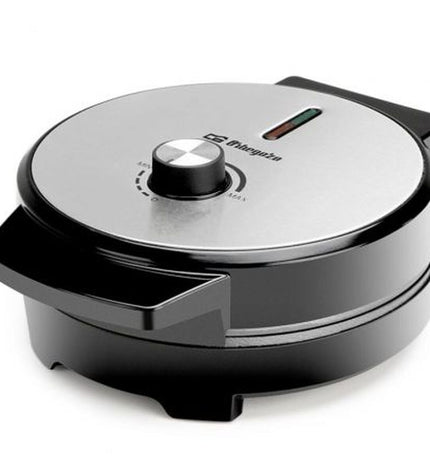 Orbegozo 18319 waffle maker with 1000W power, compact electric appliance for home cooking, featuring non-stick plates and easy operation.
