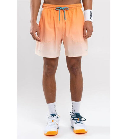 Men's Nox Sport tennis sports shorts in vibrant orange, designed for outdoor tennis activities and active sports.
