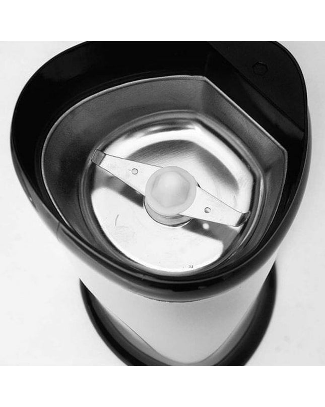 Orbegozo MO 3250 coffee grinder with 150W motor, black housing, showing the textured grinding burrs and control knob.