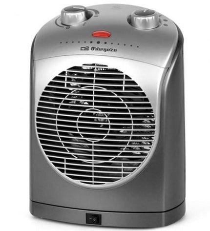 Orbegozo FH 5022 portable heater with 2000W power, suitable for home heating and cooling, shown in a home environment.