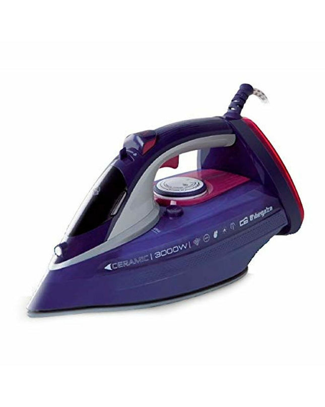 Orbegozo SV 3000 black steam iron with 3000W power, shown with cord and water tank in a home ironing setting.