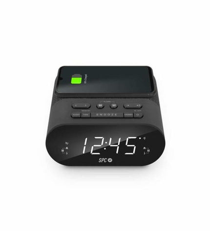 SPC alarm clock with wireless charger, digital display, and sleek black design, suitable for bedside or desk use.