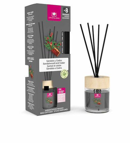 Cristalinas Sandalo-Cedro parfum sticks, 35 ml, displayed in a clear container with elegant packaging, used for home decor and fragrance.