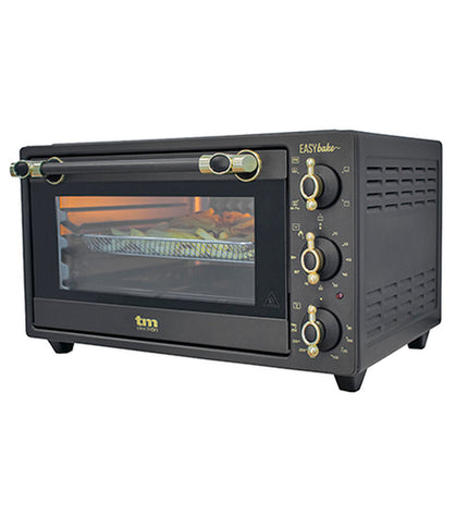TM Electron 1500W deep fryer showing compact design, control panel, and heating element in a kitchen setting.