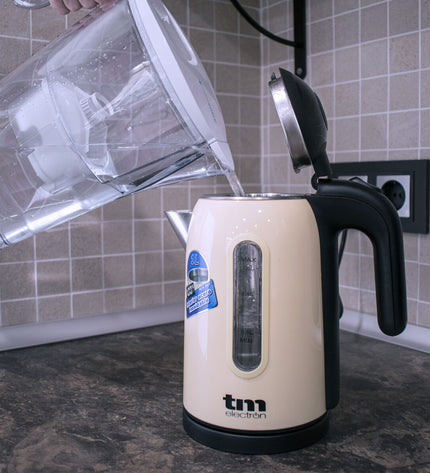 TM Electron 2.3L kitchen kettle with filter, showing the spout and handle, for boiling water and tea preparation.