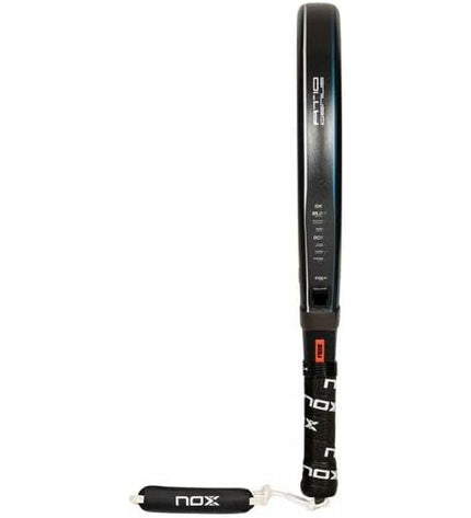 Nox Sport AT10 Luxury Genius 12K paddle tennis racket with sleek design, used outdoors for padel tennis, inspired by Agustín Tapia