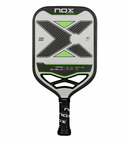 Nox Pro Shield pickleball paddle with black carbon fiber surface, designed for paddle tennis, by Nox Sport.