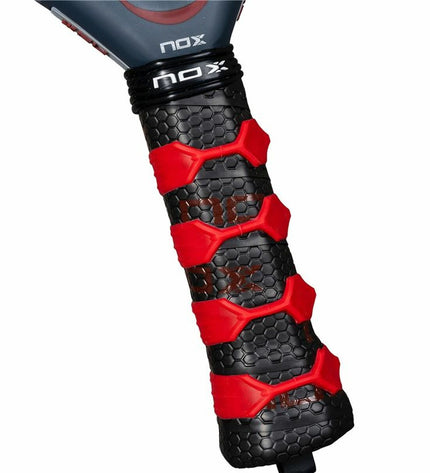 Nox-Xtreme AT10 Genius padel racket with 12K carbon fiber face, designed for paddle tennis, in black and blue with ergonomic grip