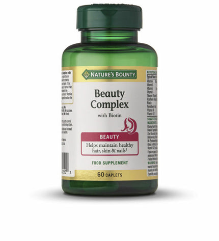 Bottle of Nature's Bounty Vitamin B7 Beauty Complex Biotine supplement with 60 capsules for healthy hair and skin.