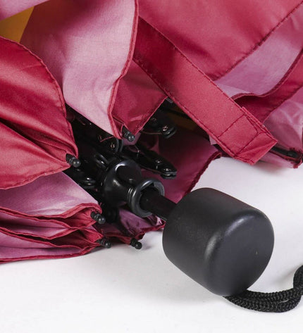 Foldable Harry Potter Gryffindor umbrella for luggage, featuring red and gold colors with Gryffindor crest design.