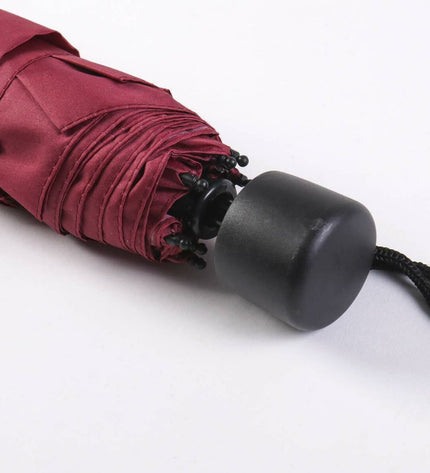 Foldable Harry Potter Gryffindor umbrella with bagage and compact design, featuring the iconic Gryffindor crest and red and gold colors.