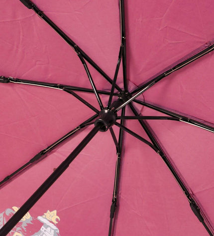 Foldable Gryffindor Harry Potter umbrella in bagage and paraplu's style, featuring the iconic red and gold crest design.
