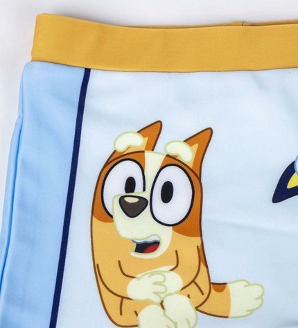 Bluey boys' light blue swim trunks for boys, suitable for sports and watersports, displayed on a model.