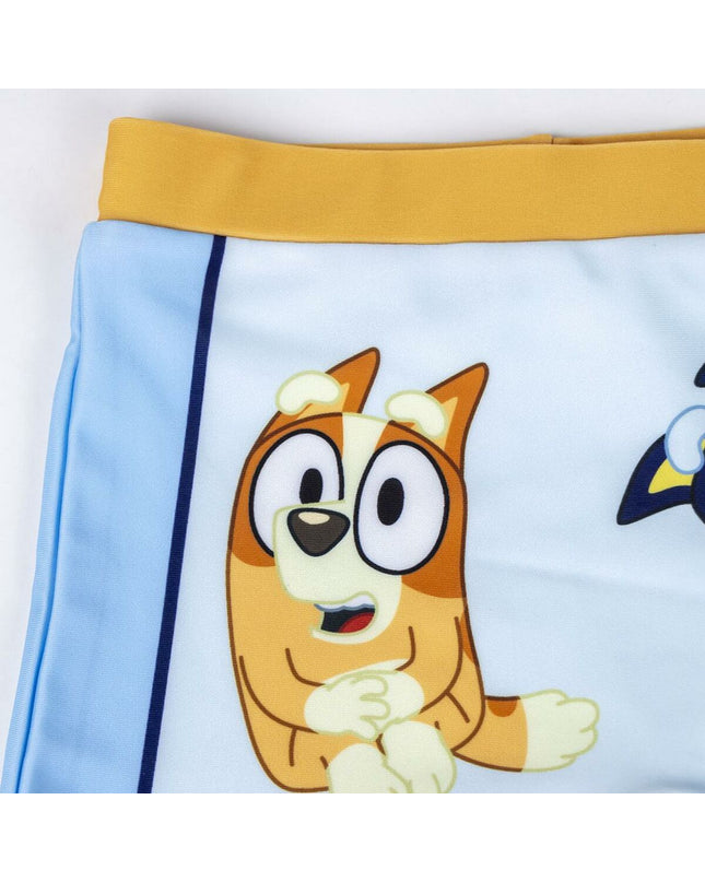 Bluey boys' light blue swim trunks for boys, suitable for sports and watersports, displayed on a model.