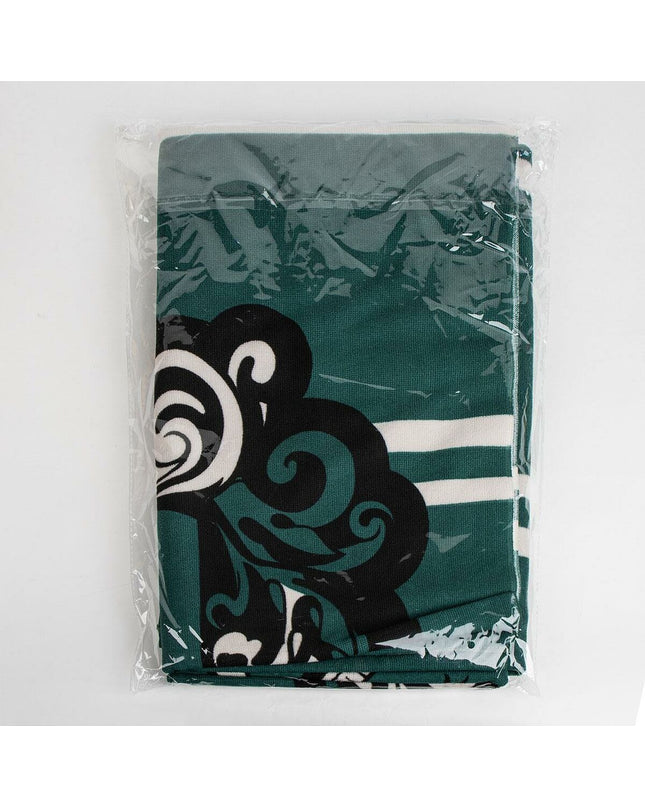 Green Harry Potter-themed beach towel with house crest design, ideal for bath or home use.