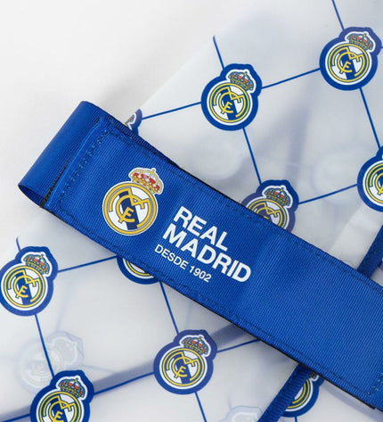 Blue Real Madrid C.F. dog raincoat in XS size, featuring team logo, designed for dogs to stay dry during rainy weather.