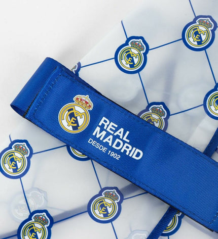Blue Real Madrid C.F. dog raincoat, size M, with team logo and waterproof material for dogs.
