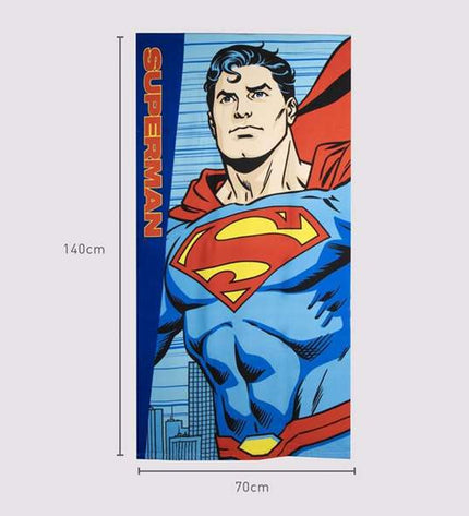 Superman blue beach towel measuring 70 x 140 cm, featuring Superman logo and design, ideal for bath and beach use.
