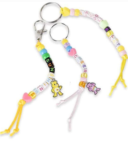 Care Bears craft kit for making bracelets, featuring colorful beads and charms, ideal for creative activities and toys.
