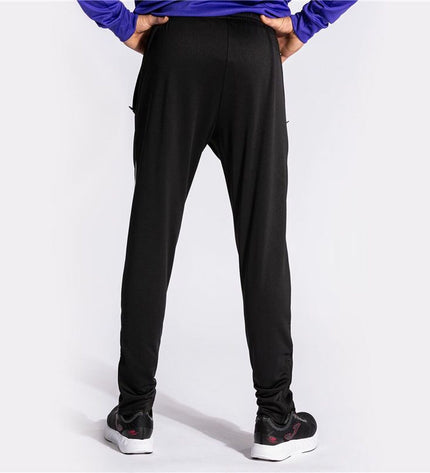 Joma Sport Championship VII soccer training pants for adults, men, and children, in sport and outdoor football setting.