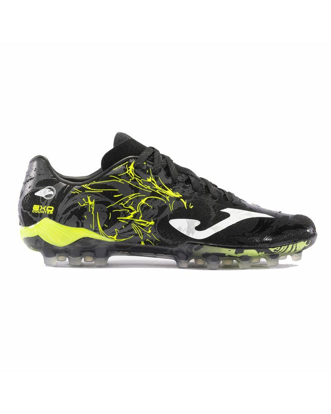 Yellow and black Joma Sport Supercopa adult soccer cleats for outdoor football, with detailed studded sole design.