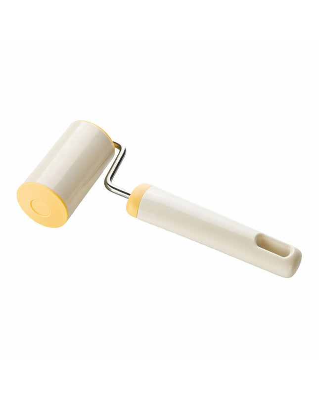 Plastic deegroller Tescoma Delicia for baking and cooking, shown resting on a wooden surface with dough underneath.