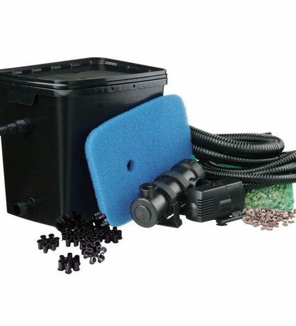 Ubbink FiltraPure 4000 automatic pool cleaner in a garden pool, showing its compact design and cleaning components.