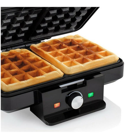 Tristar WF-1165 black waffle maker with 1000W power, showing textured non-stick cooking plates and compact design.