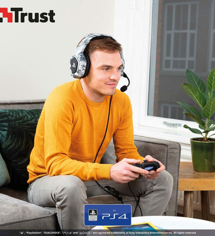 Gray Trust wireless headset with over-ear design, compatible with plug-and-play gaming consoles, for clear audio and comfortable fit.