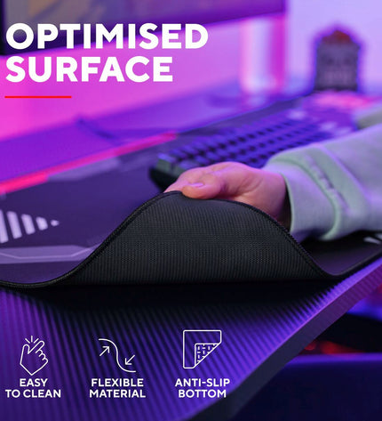 Trust 25716 black gaming mat for electronics and plug & play game consoles, showing a sleek black surface suitable for gaming setup.