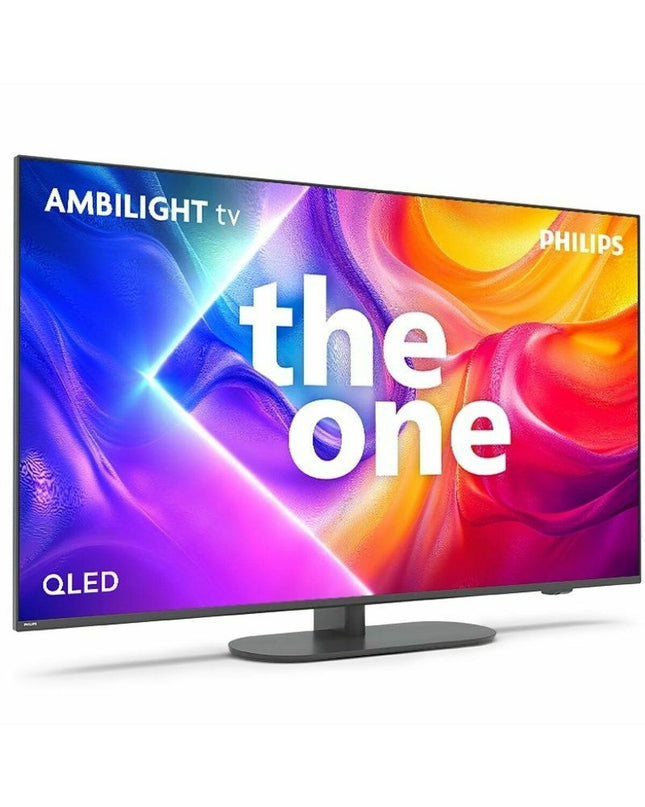 Philips 55-inch 4K Ultra HD LED QLED Smart TV with HDR, sleek screen and slim black bezel, in a modern living room setting.