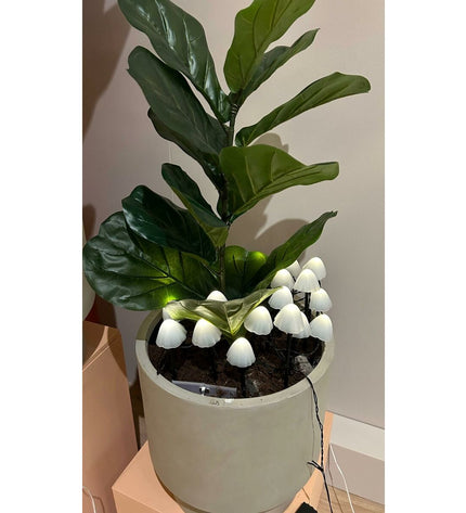 Set of 20 Lumineo decorative outdoor plant lights featuring white mini mushroom-shaped lanterns for garden decoration.