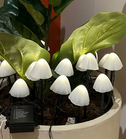 Set of 20 Lumineo decorative outdoor plant lights shaped like mini white mushrooms for garden decoration.