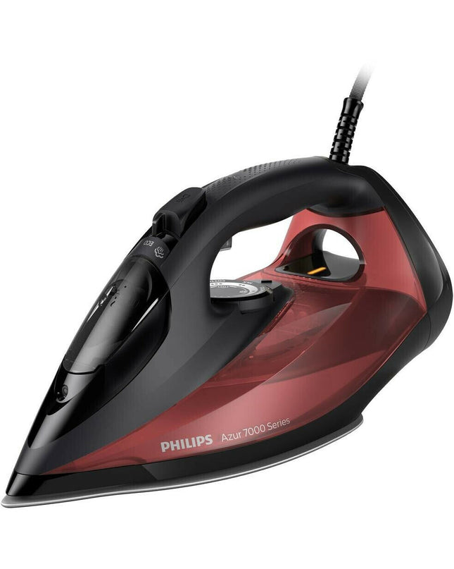 Philips DST7022/40 steam iron with digital display and ergonomic handle, placed on a white ironing board.