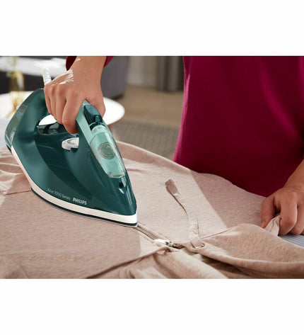 Philips DST7031/70 steam iron with water tank and control buttons, designed for household clothing ironing.