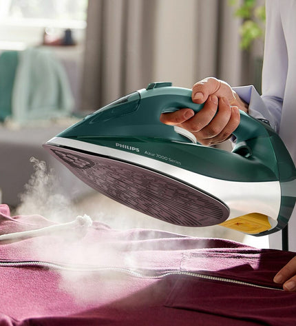 Philips DST7031/70 steam iron with digital display, ergonomic handle, and sleek design for efficient home ironing.