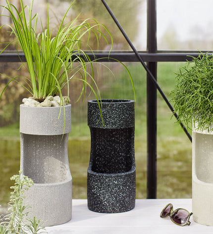 Lifetime Tuinfontein outdoor water fountain with a cylindrical design, decorative garden water feature for outdoor spaces.