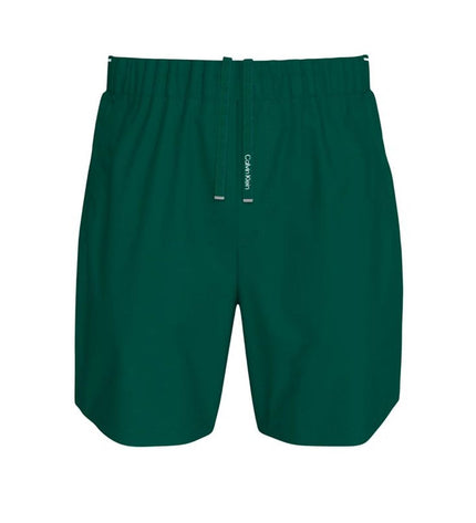 Calvin Klein men's woven green swim trunks for watersport and outdoor activities, featuring a sporty design and comfortable fit.