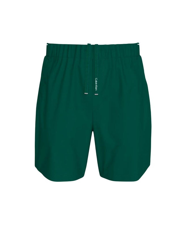 Calvin Klein men's woven green swim trunks for watersport and outdoor activities, featuring a sporty design and comfortable fit.