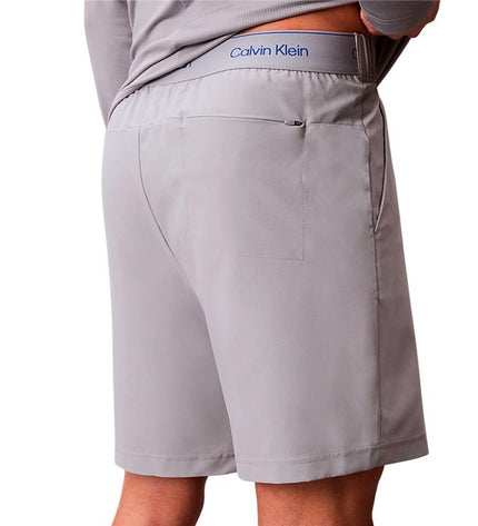 Gray Calvin Klein men's swim shorts for sport and watersport, woven fabric, with a relaxed fit and adjustable waistband.