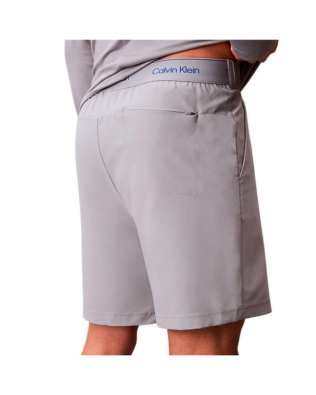 Gray Calvin Klein men's swim shorts for sport and watersport, woven fabric, with a relaxed fit and adjustable waistband.