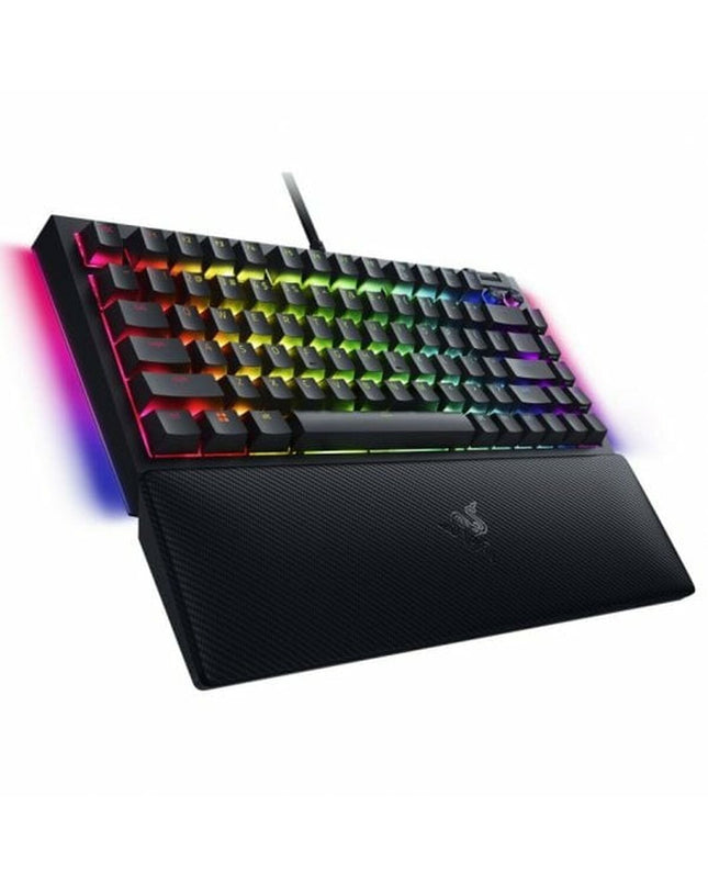 Razer BlackWidow V4 gaming headset with microphone, plugged into a gaming console, featuring sleek design and comfortable ear cups.