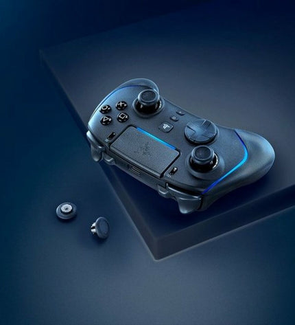 Razer black remote control for plug-and-play gaming consoles with ergonomic design and multiple buttons.