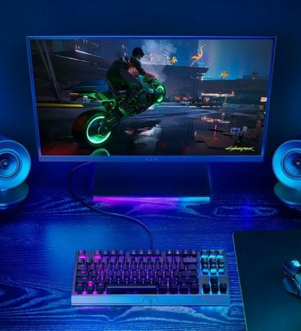 Razer Bluetooth portable speaker with sleek black design, compact size, and buttons for easy control, ideal for gaming and on-the-go audio.