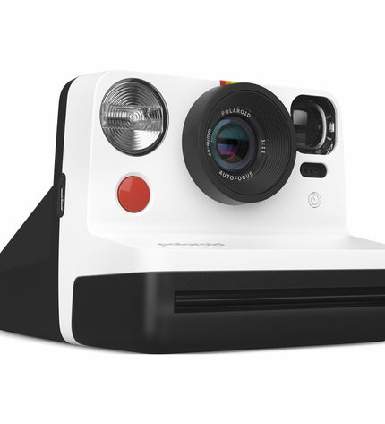 Polaroid instant camera in black with lens, viewfinder, and shutter button, compact electronic photography device.