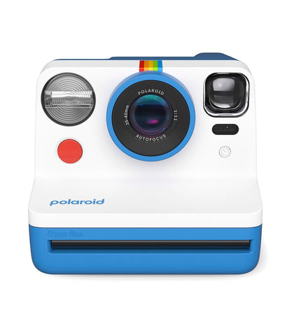 Polaroid instant camera in blue, compact electronic device for instant photography, measuring 11.2 x 9.4 x 15 cm.