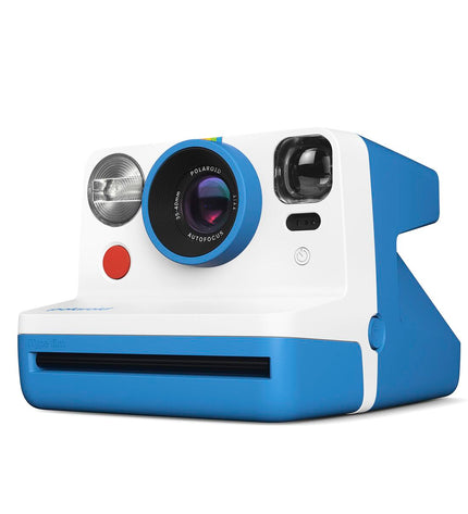 Polaroid instant camera in blue, compact photography device with dimensions approximately 11.2 x 9.4 x 15 cm, for instant photo printing.