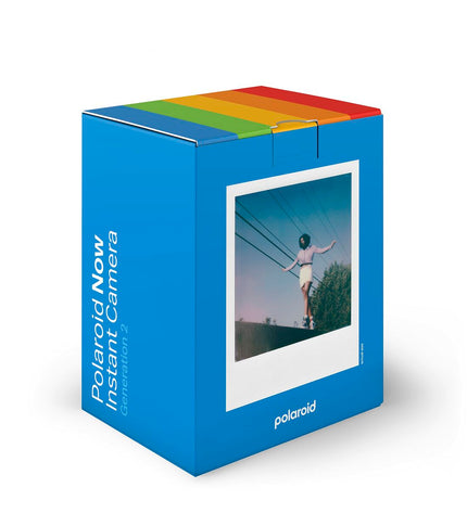 Polaroid instant camera in blue, compact electronic device for instant photography, measuring approximately 11.2 x 9.4 x 15 cm.